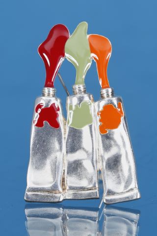 Broche tubes de couleurs orange, vert et rouge