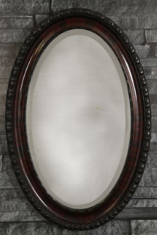 Miroir ovale sculpté