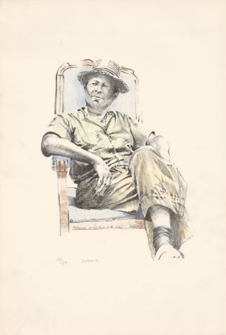 Homme au chapeau dans un fauteuil