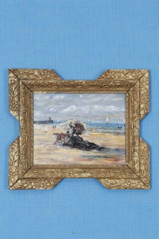 Femme à l’ombrelle en bord de mer