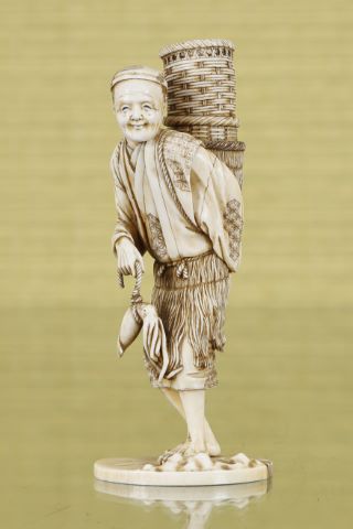 Okimono représentant un marchand de poulpes