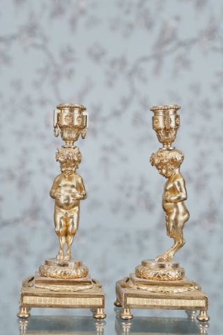 Paire de bougeoirs au faune